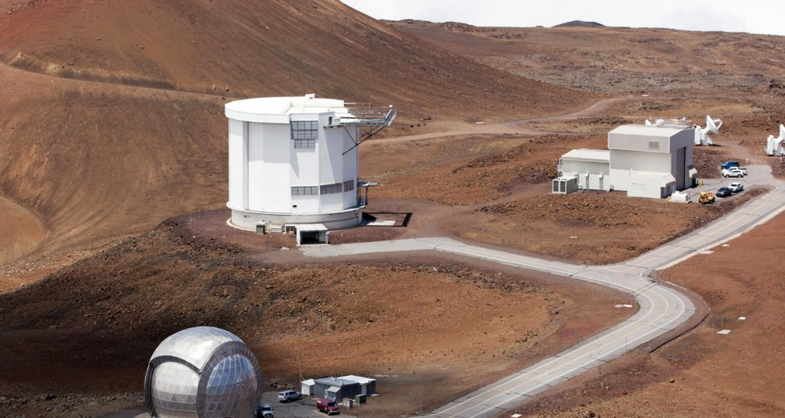 In this Aug. 31, 2015, file photo, from bottom left, the Caltech Submillimeter Observatory, the James Clerk Maxwell Telescope and the Submillimeter Array, far right, are shown on Hawaii's Mauna Kea near Hilo, Hawaii. Observatories on Hawaii's tallest mountain have shut down operations in response to the governor's stay-at-home order aimed at preventing the spread of the coronavirus. (Source: Caleb Jones)